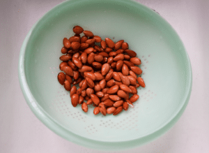 almonds in green strainer